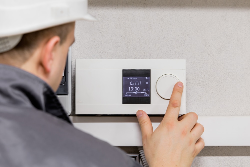 Engineer,Adjusting,Thermostat,For,Efficient,Automated,Heating,System Thermocouple Wire Types