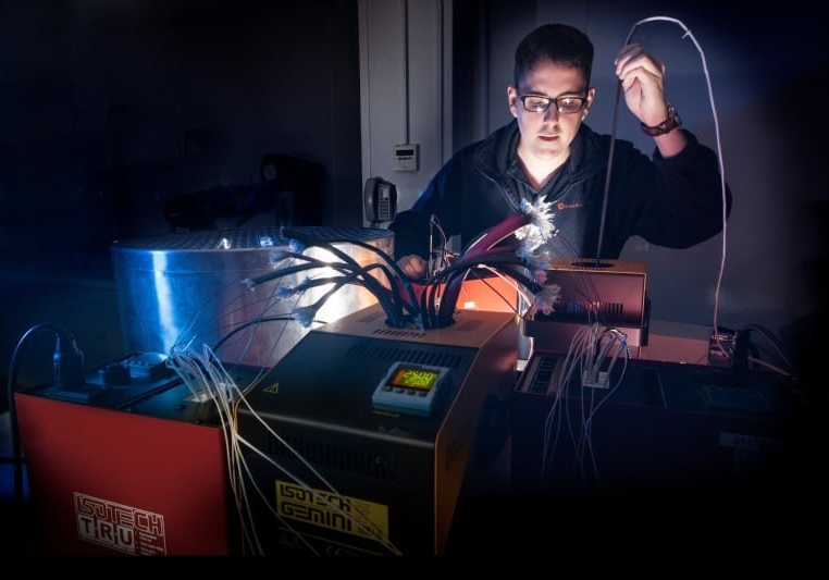 Engineer working in lab with wire